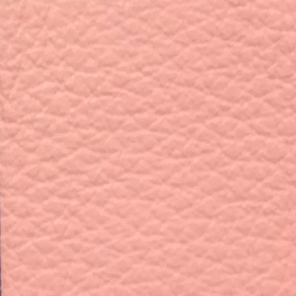 Close-up of a Harbor Powder Pink fabric swatch in a soft light pink tone with subtle texture, showcasing its raised areas and grooves that give it a natural and elegant feel. The soft sheen highlights the depth of its texture.