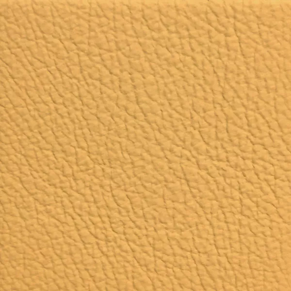 Close-up of a Harbor Ratan fabric swatch in a soft yellowish-beige tone with texture, showcasing its raised areas and grooves that give it a natural and elegant feel. The soft sheen highlights the depth of its texture.