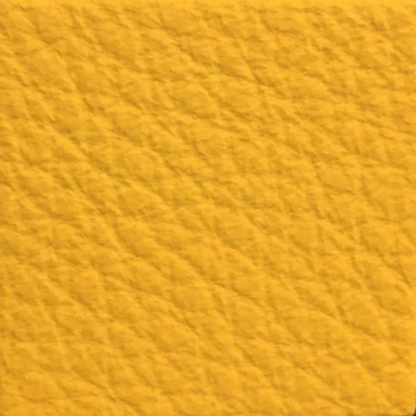 Close-up of a Harbor Sunset Gold fabric swatch in a warm golden yellow tone with texture, showcasing its raised areas and grooves that give it a cozy and elegant feel. The soft sheen highlights the depth of its texture.