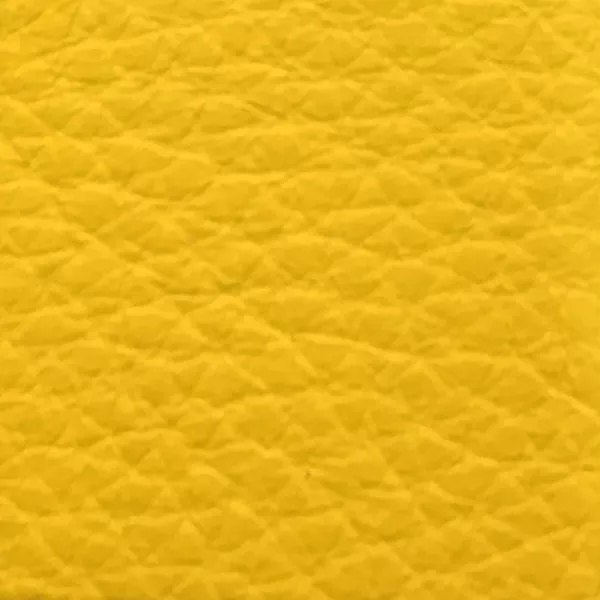 Close-up of a Harbor Super Lemon fabric swatch in a vibrant lemon yellow tone with texture, showcasing its raised areas and grooves that give it a cheerful and elegant feel. The soft sheen highlights the depth of its texture.