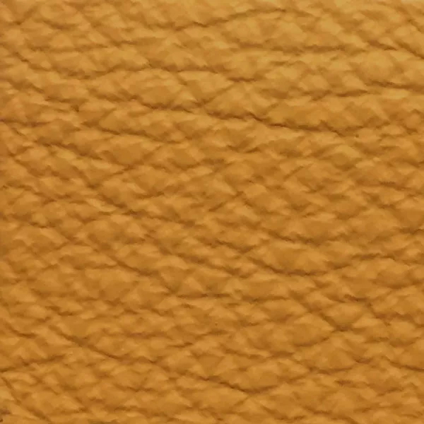 Close-up of a Harbor Warm Apricot fabric swatch in a warm apricot tone with texture, showcasing its raised areas and grooves that give it a cozy and elegant feel. The soft sheen highlights the depth of its texture.