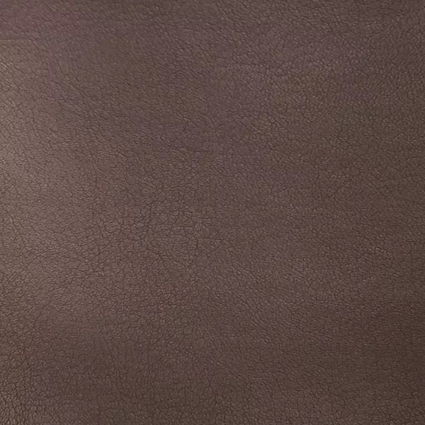 A close-up of Komodo 12408 Synthetic Leather shows a fine, slightly raised texture with subtle variations in a warm, medium brown.