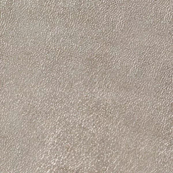 A close-up of Lux 7051 Synthetic Leather reveals a subtly textured surface with a fine, irregular grain in a soft, light gray.