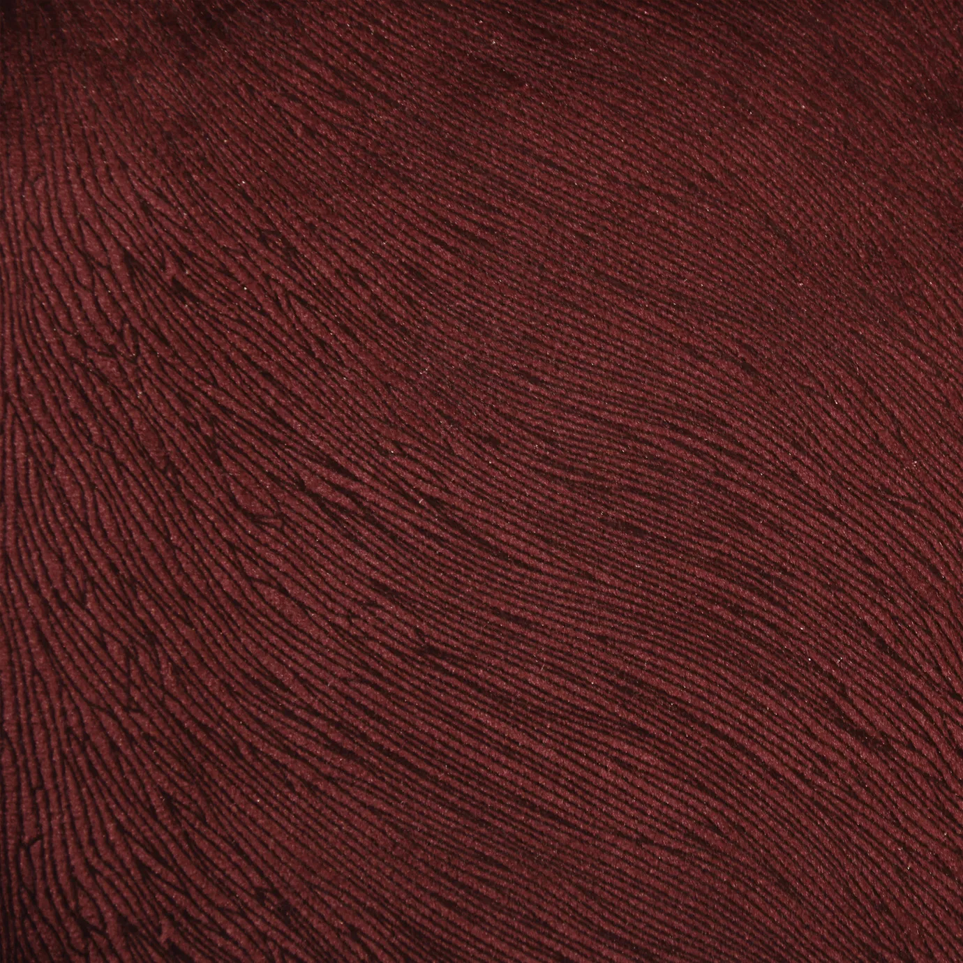 Deep red, textured Hide Velvet 010 fabric shown in a close-up view.