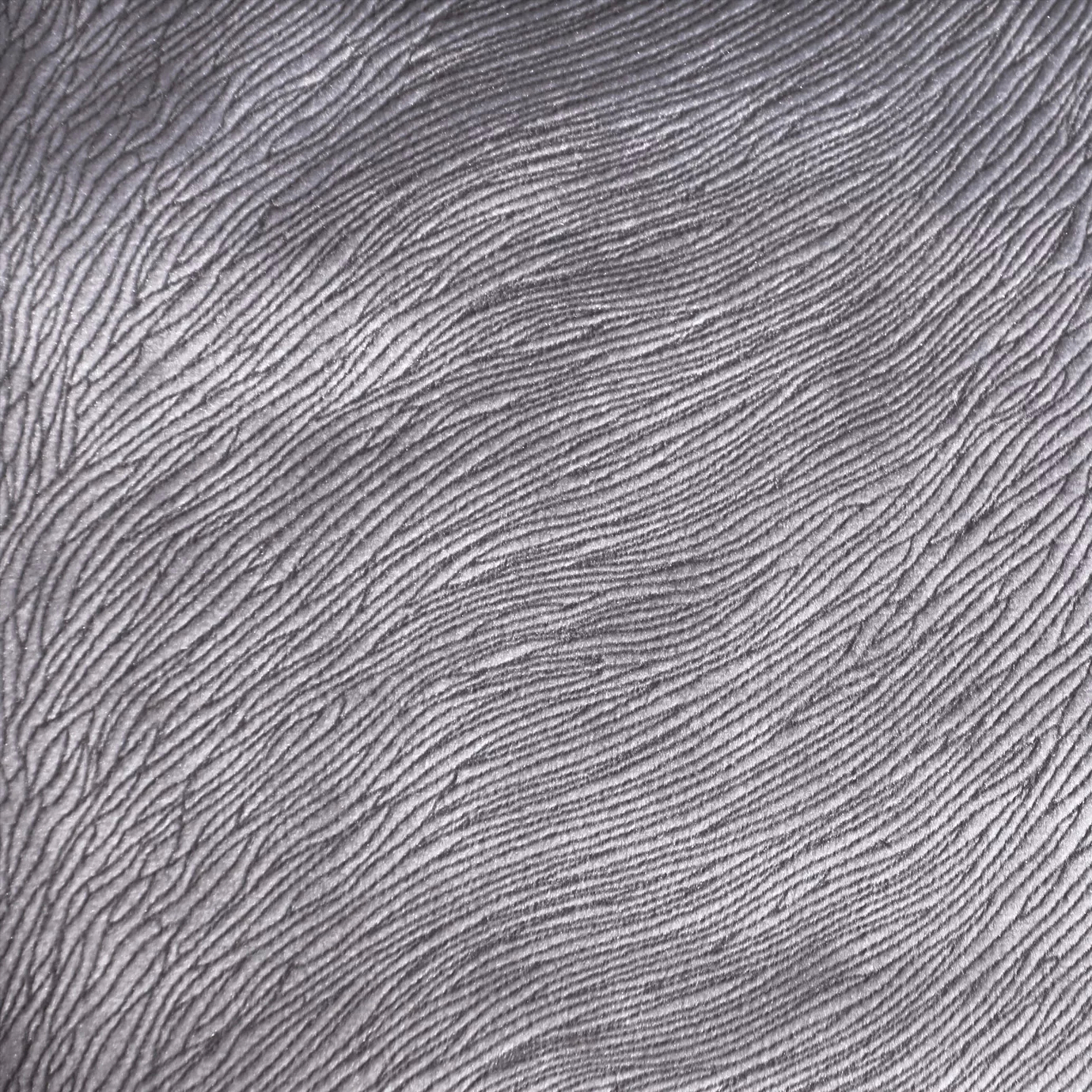 Close-up of Hide Velvet 093 fabric, showcasing a textured pattern in a light silver or pale gray color.