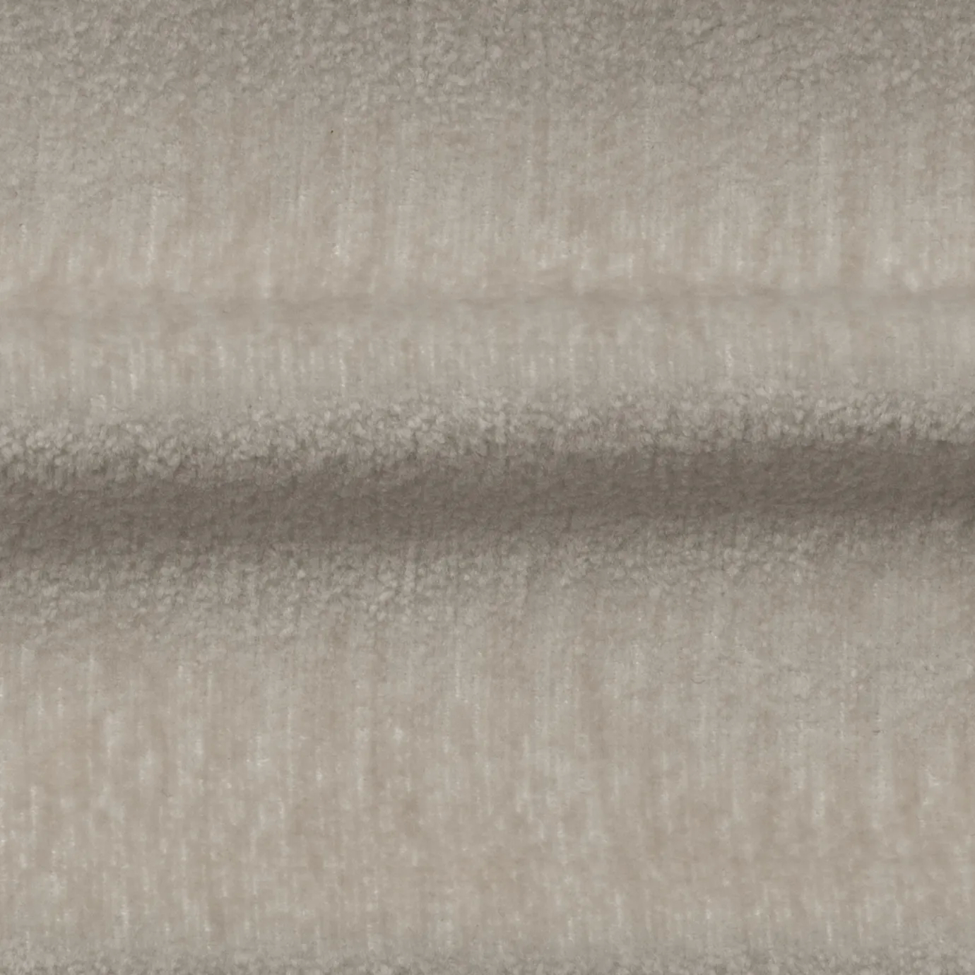 Soft, textured Champagne Belle Velvet fabric with subtle variations in its light, warm tones, creating a plush and inviting surface.