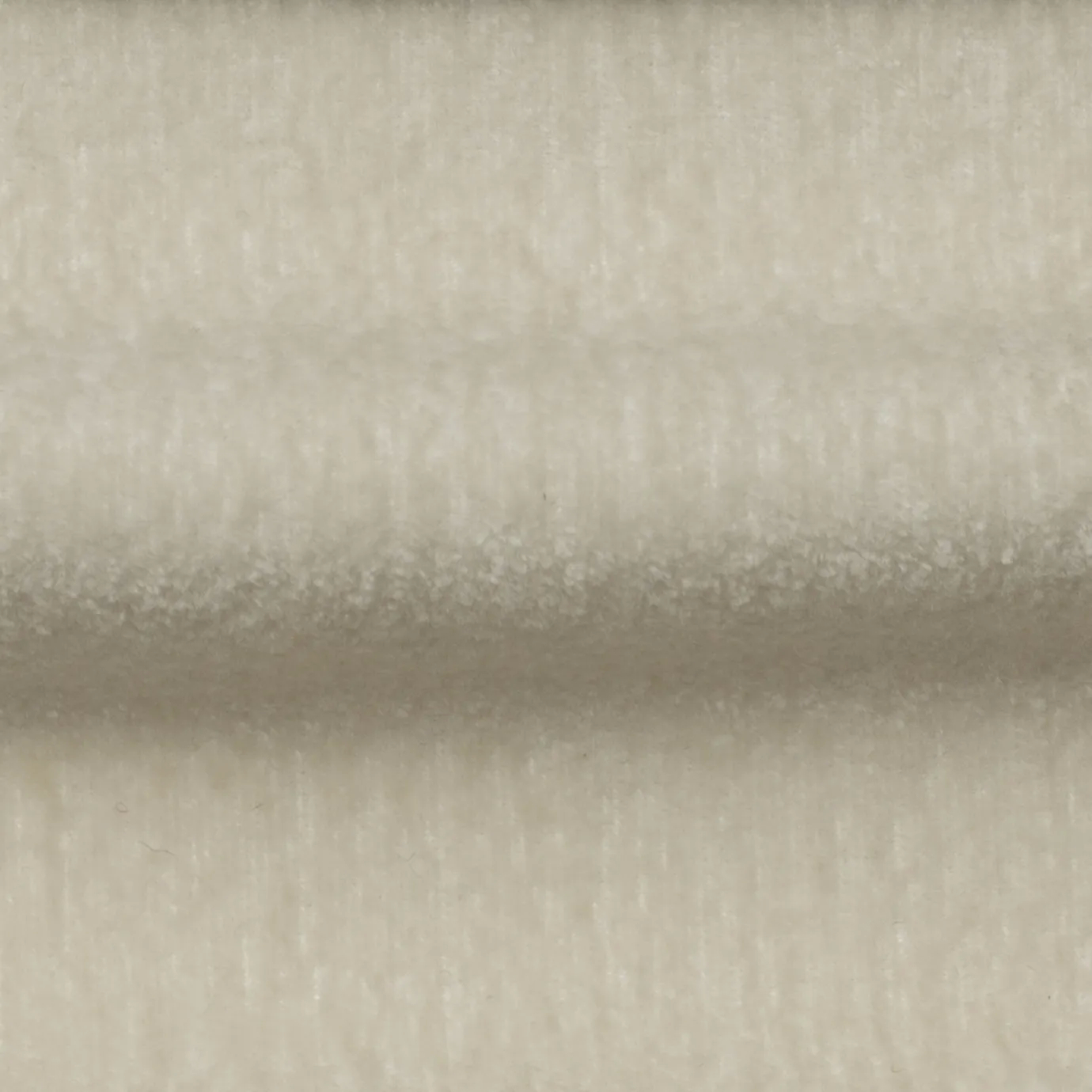 Soft, textured Milkshake Belle Velvet fabric with subtle variations in its light, creamy tones, creating a plush and inviting surface.