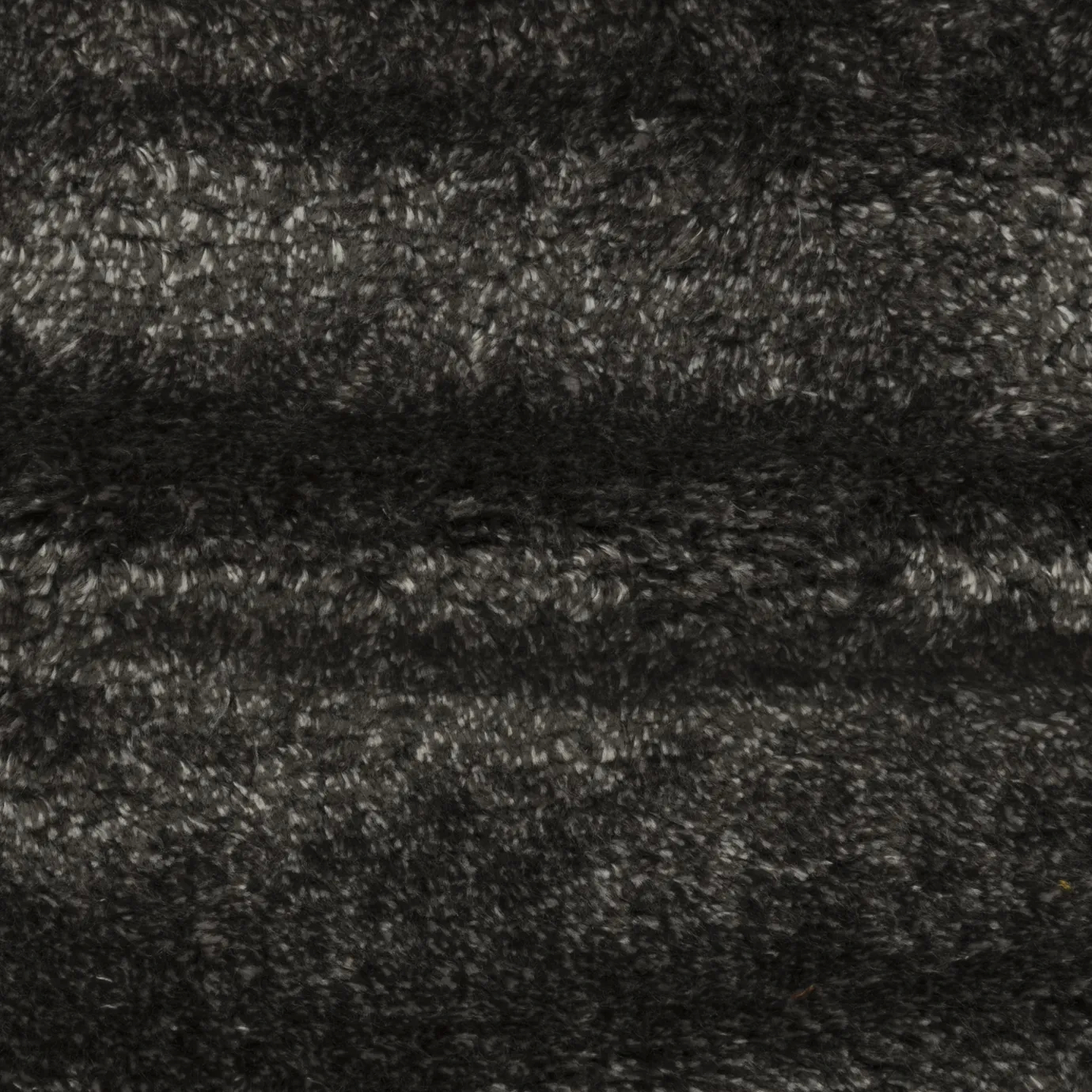 Close-up of Paris Gris Lush Velvet Fabric, showcasing its soft, textured surface and sophisticated dark gray color.
