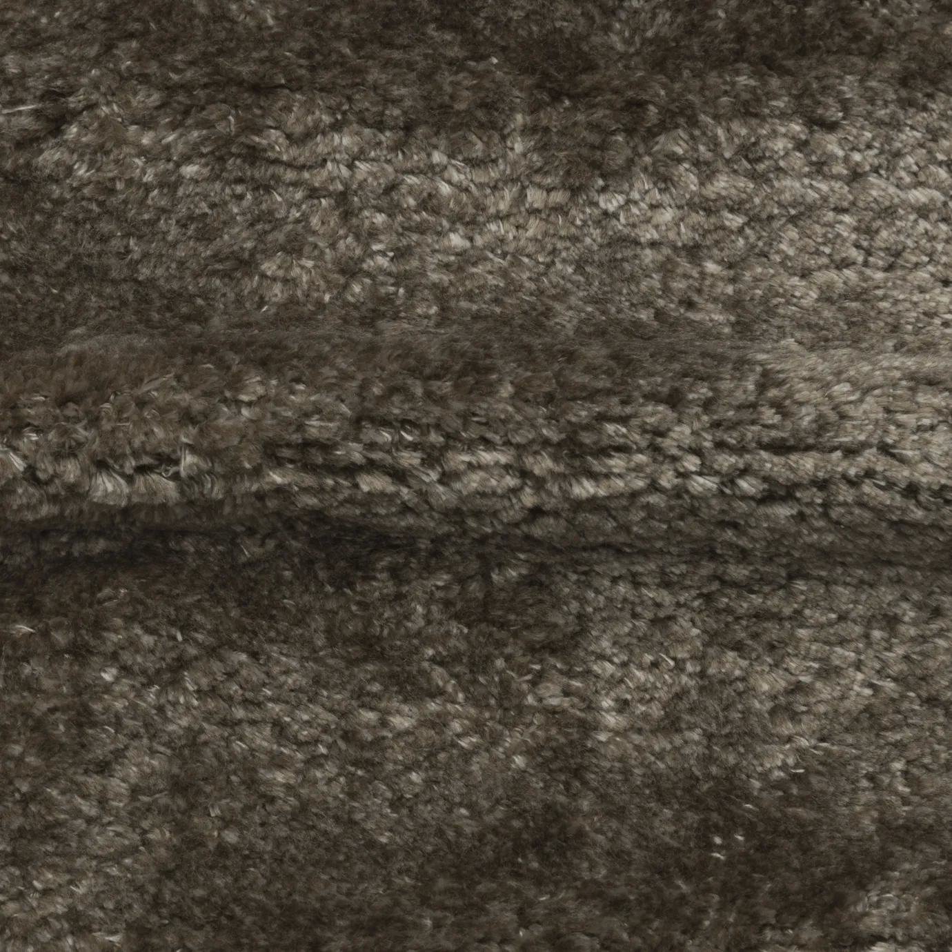 Close-up of Visón Lush Velvet Fabric, showcasing its soft, textured surface and rich, brown tone.