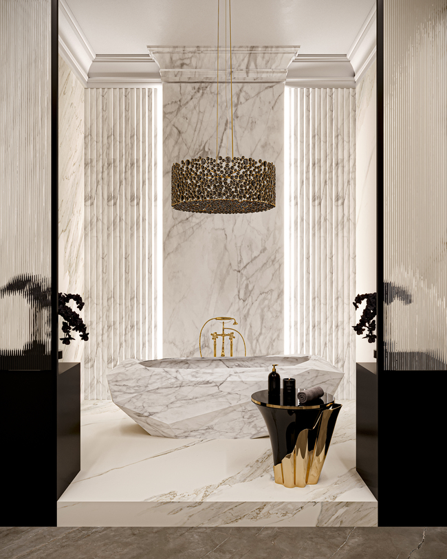 Lavish Bathroom Design featuring KOKET's Eternity Oval Black Glass Chandelier and Yasmine Polished Brass Side Table and Maison Valentina's exquisite Diamond Marble Bathtub.