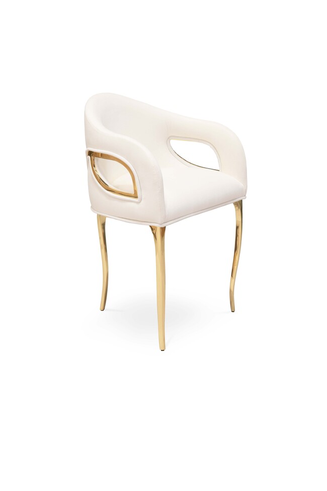 Chandra Chair: a luxurious contrast of white and golden, distinguished by its unique three-legged design.
