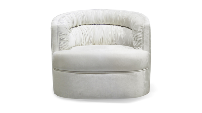 The Cocktail Chair features a creamy upholstery fabric that exudes a sense of luxury and comfort.