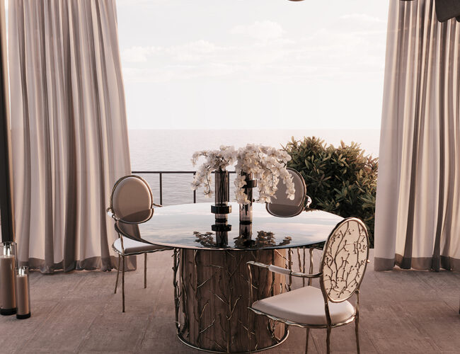 Outdoors Dining Al Fresco space, with teo elegant chairs in cream tones and a glass table.