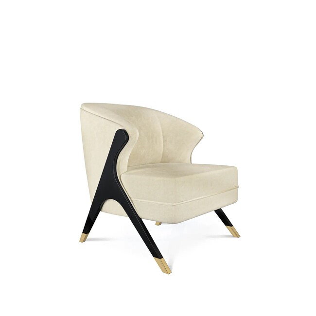 Elegant Naomi Chair with simple lines features a clean cream upholstery and black structure, with golden metal tipped feet.