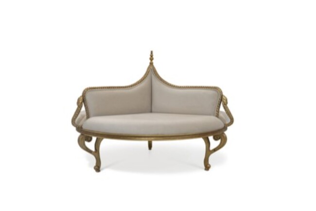 Magnificent Sofa has classic lines, with creamy upholstery and a golden hand-carved serpent resembling structure.
