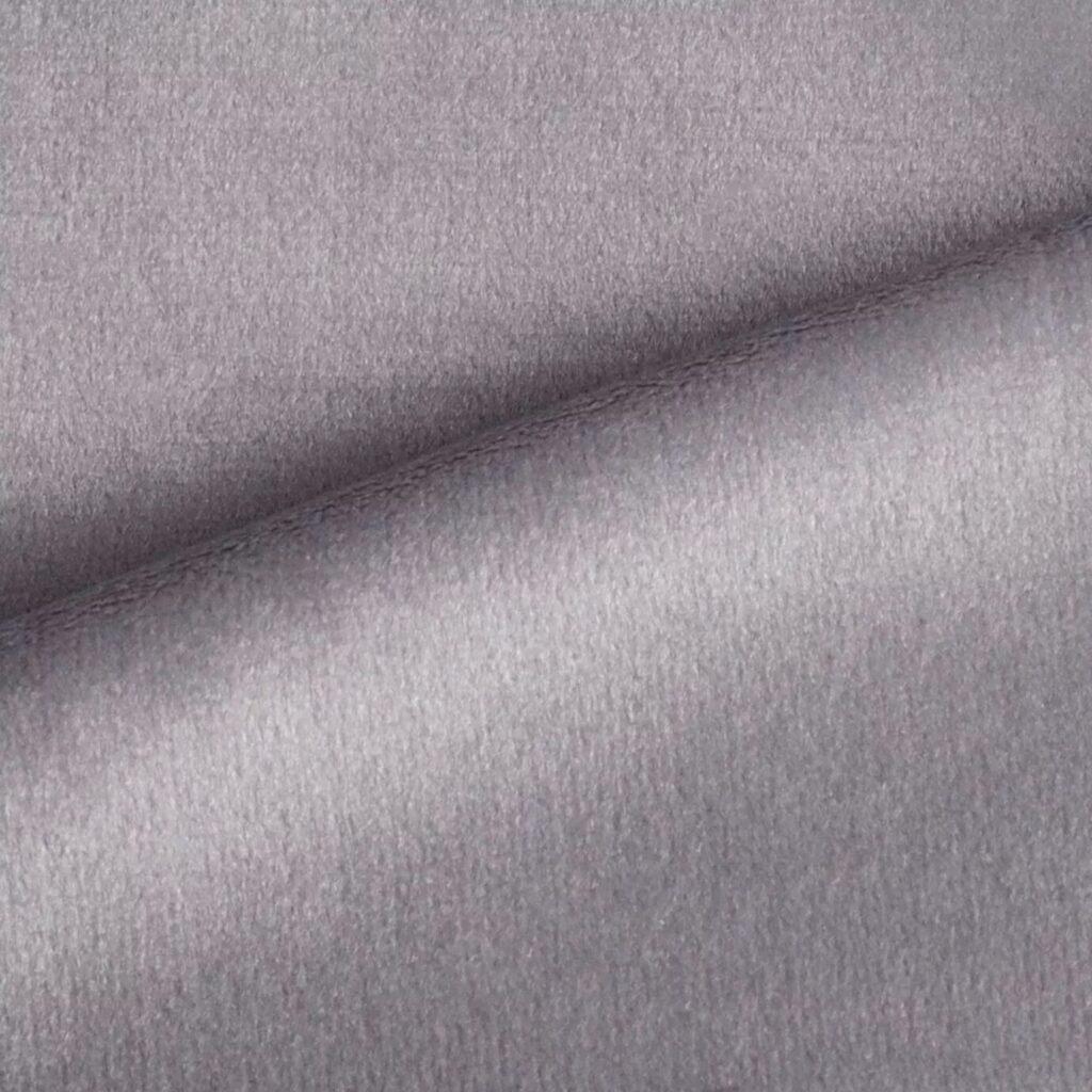 A luxurious selection of textiles and fabrics from KOKET, featuring a variety of rich textures, vibrant colors, and intricate patterns designed to enhance the elegance and style of any furniture piece.