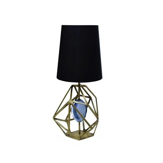 Gem Table Lamp: featuring a golden structure incapsulating a blue gem, this table lamp has a black lampshade.