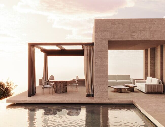 A vacation house by a pool, with two outdoor spaces. One of them has a dining table and four chairs surrounding it and the other space has rwo sofas and a golden center table.