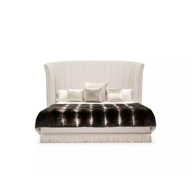 Sevilliana Bed has a graceful, slightly curved frame in cream tones.