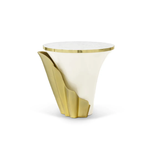 Featuring a sultry silhouette, Yasmine Mother of Pearl Side Table has a white mother of pearl tabletop with golden edges, set on a solid wooden pink base, adorned with a golden structure that arches back and forth.