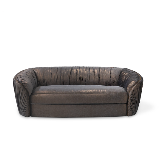 Luscious Sofa, with is curved lines, features a luxuirous shimmering upholstery.