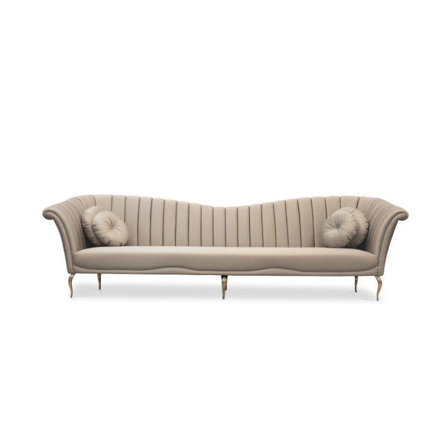 Long Caprichosa Metal Base Sofa: this modern sofa in cream hues has a slight curved backrest and metal base.