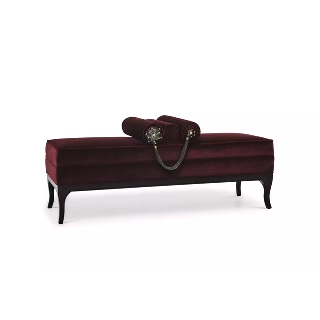 Lé-Lé Bench features a dark red upholstery with two pillows and a black structure.