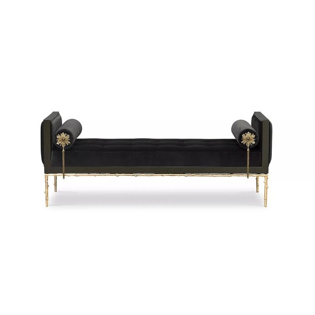 A black upholestry daybed with golden structure and floral-themed details.