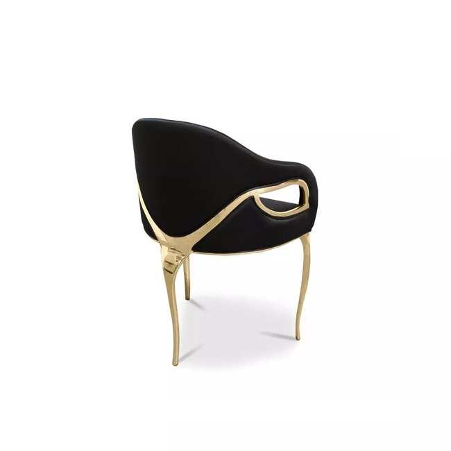 Display of Chandra Dining Chair, demonstrating its distinctive feature of only having 3 legs, contrasting with the elegant black upholstery. 