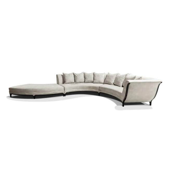 A large curved sofa, the Heavenly Sofa has cream tones and small black details.