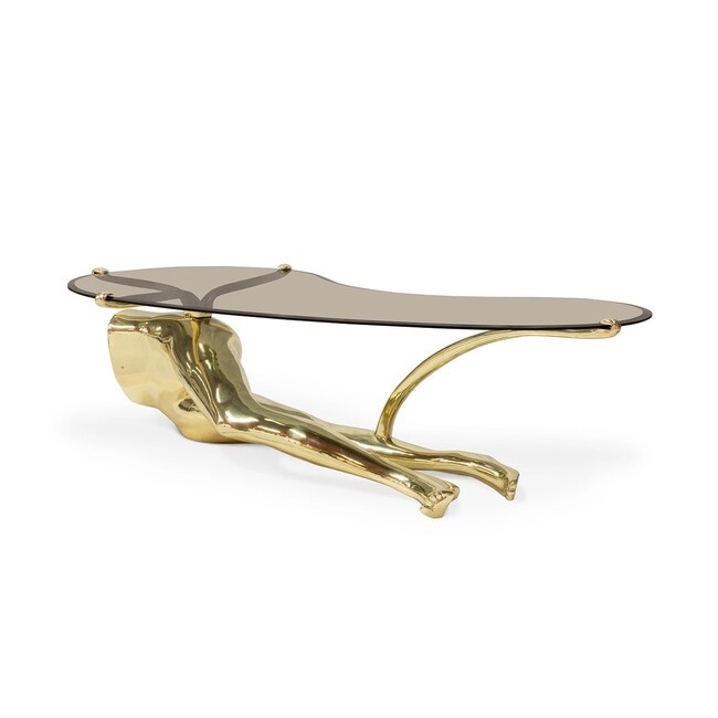 Tabu Polished Brass Coffee Table has an alluring golden base, resembling the legs of a woman, combining with the curvy smoked glass tabletop.