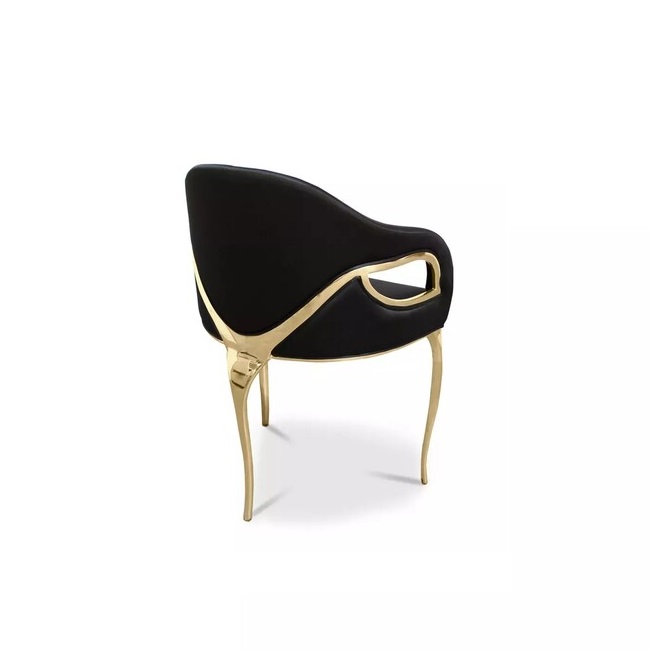 Display of Chandra Dining Chair, demonstrating its distinctive feature of only having 3 legs, contrasting with the elegant black upholstery.