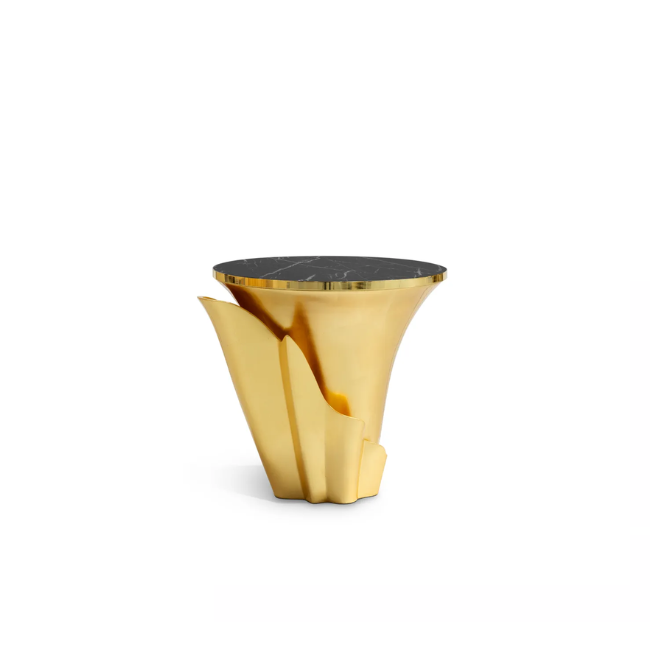 Featuring a sultry silhouette, Yasmine Gold Leaf Side Table has a black marble tabletop with golden edges, set on a solid wooden golden base, adorned with a golden structure that arches back and forth. 