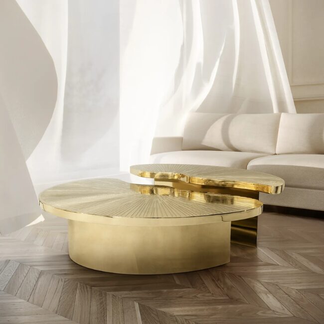 Myth Coffee Table features two individual polished brass parts, in golden hues, that can be set in different positions and form a round shape. The table top is engraved on top.