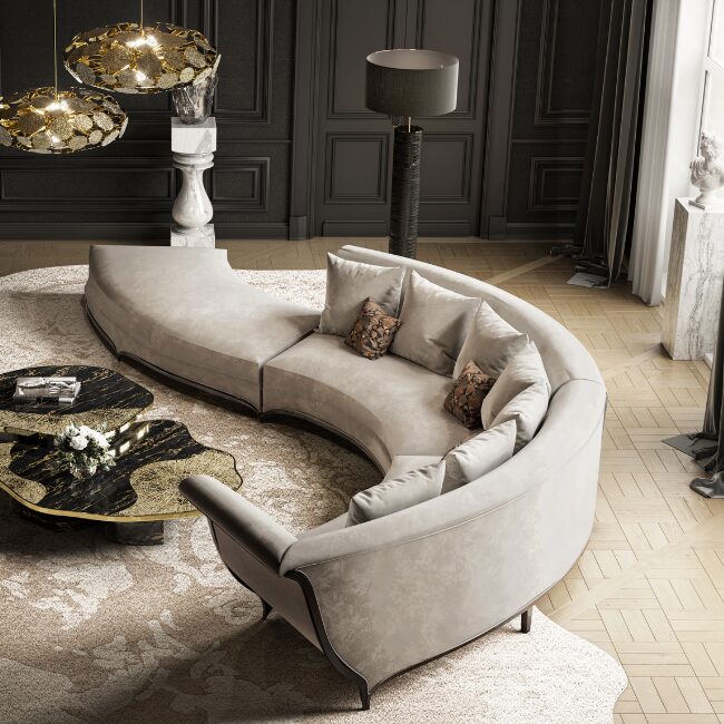 A large curved sofa, the Heavenly Sofa has cream tones and small black details.