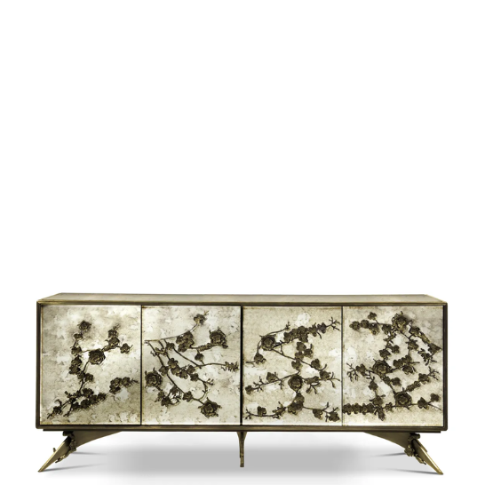 The Spellbound Aged Mirror Cabinet features an elegant golden frame and golden flower-shaped details on its four front doors.
