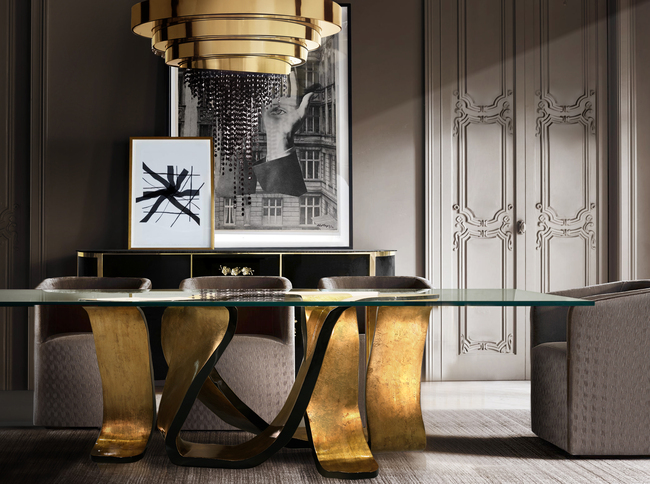A dining room with a distinctive dining table, as a statement design piece, in golden and black hues.