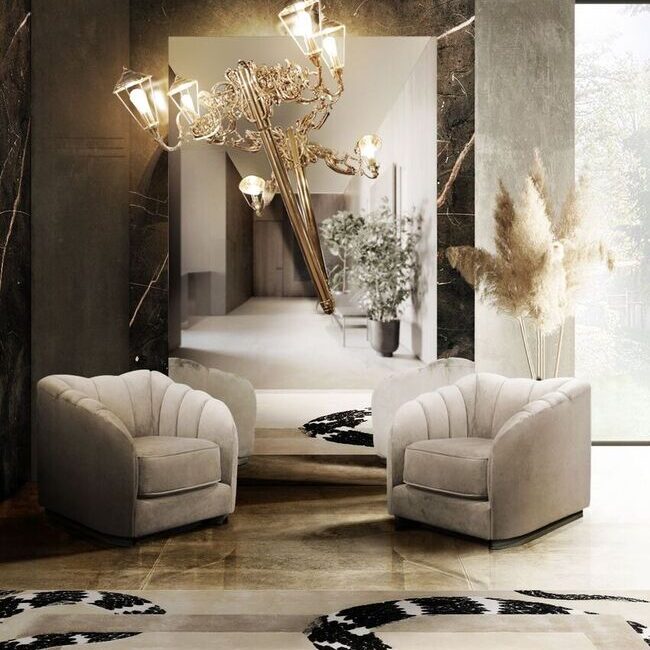 Steppe Armchair in soft green velvet with organic curves and metallic base.