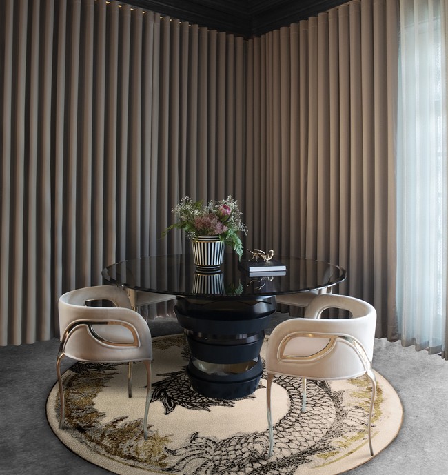 Chandra Chair by KOKET with gold accents and bold curves