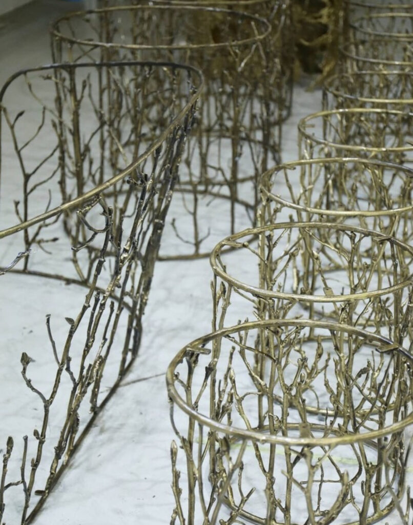 nature inspired design the making of koket's enchanted side tables and sofa with their branch inspired sand cast metal work