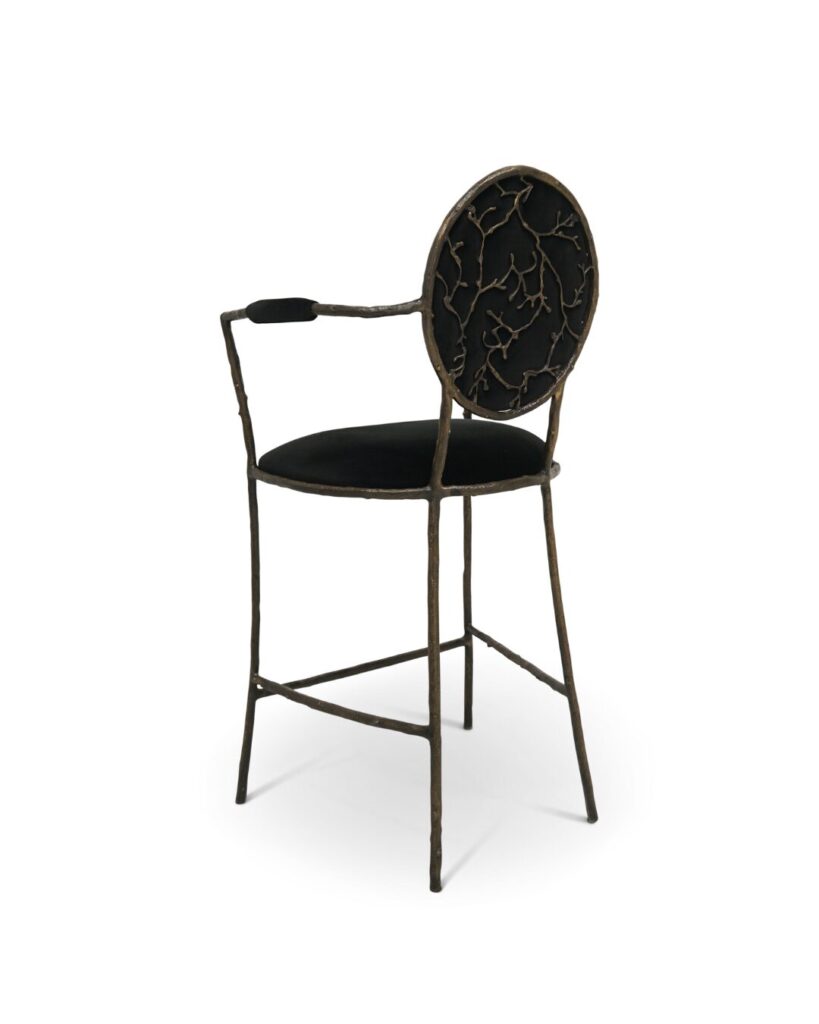 Luxury bar stool inspired by forest branches with gold frame and rich upholstery