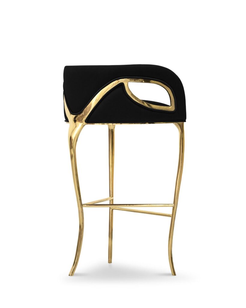 Glamorous bar stool with metallic bands and sculptural upholstery by KOKET