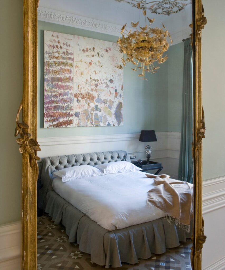 Whimsical chandelier with metal butterflies, handcrafted luxury ceiling lighting.