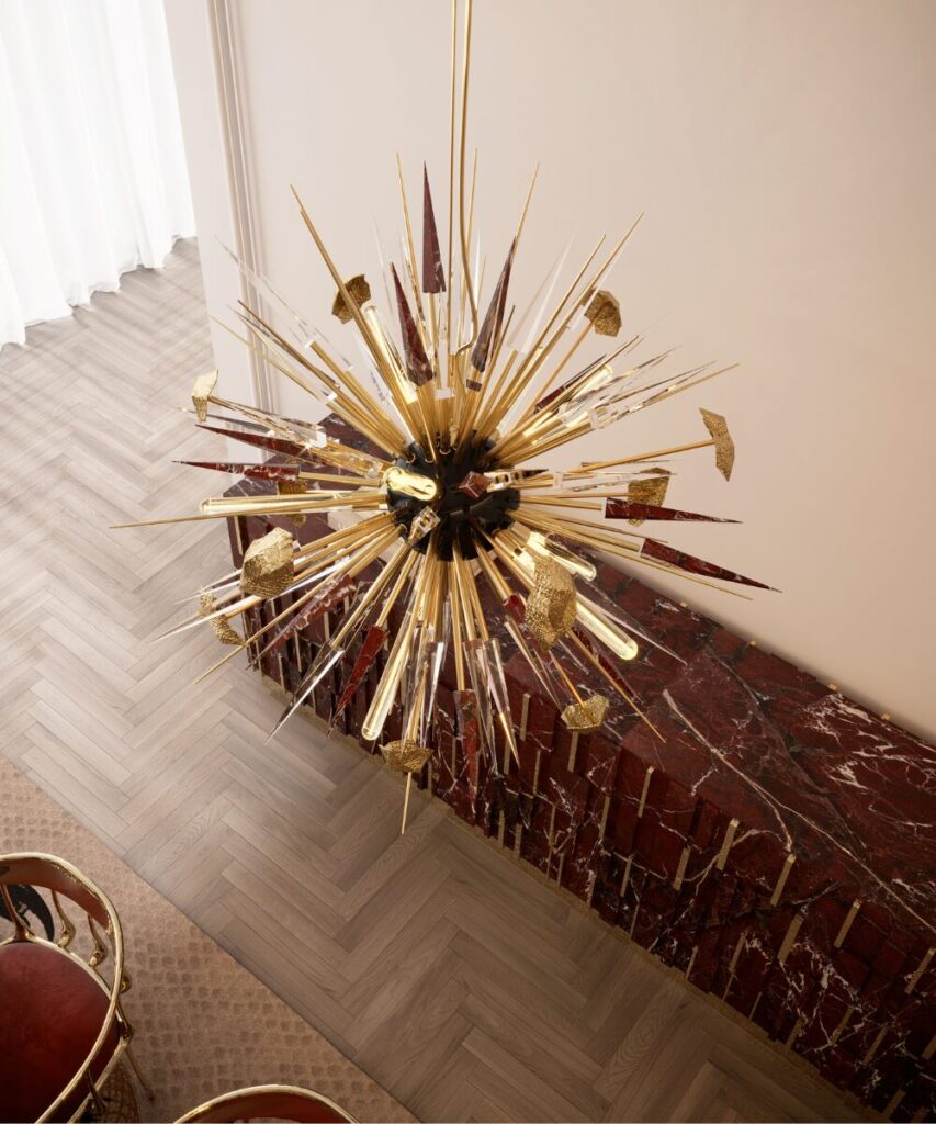 Bold ceiling chandelier in cast brass and marble, ideal for glamorous interiors.