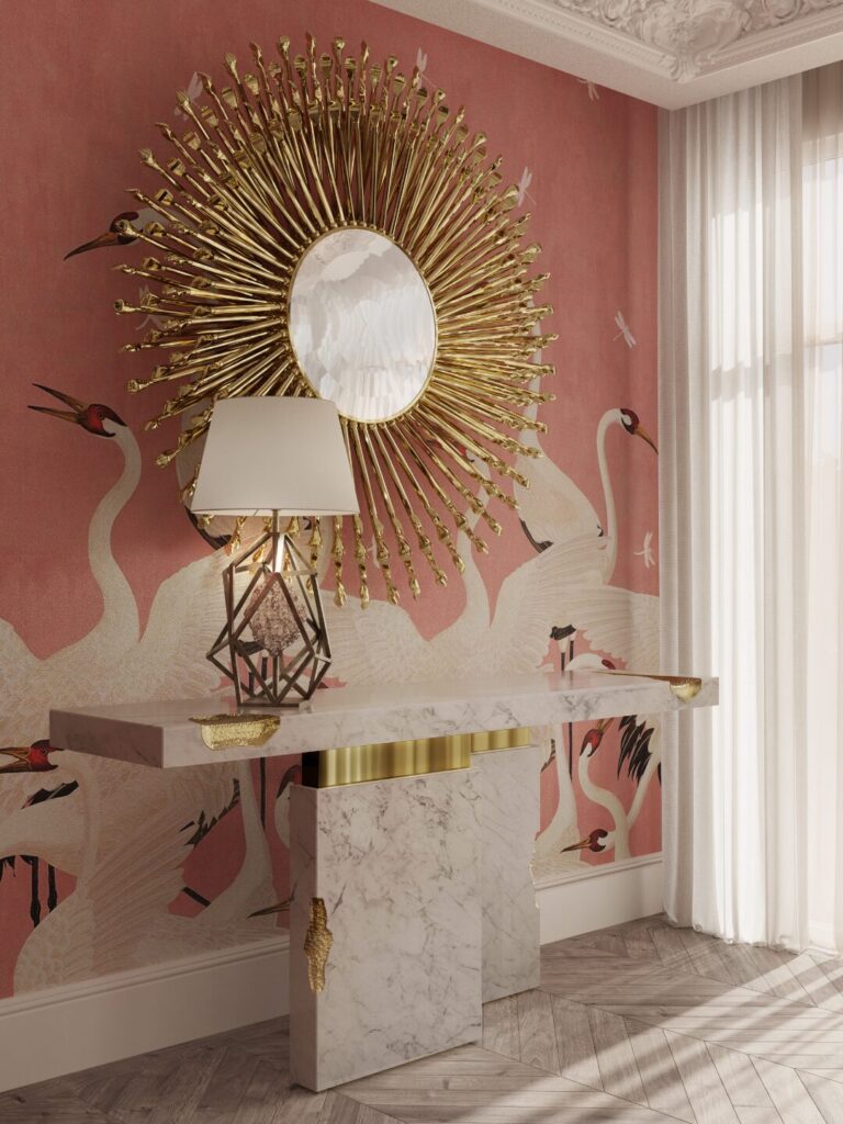 Elegant dining room decor featuring the dramatic Goddess Mirror in a brass finish.