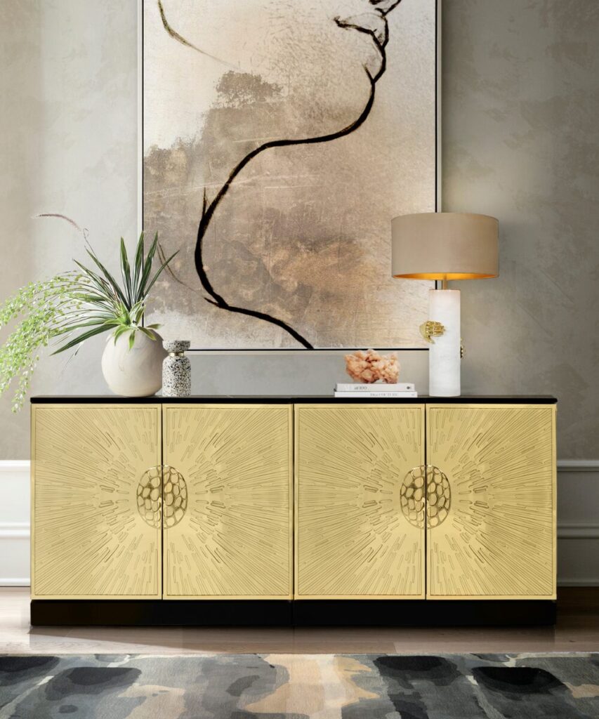 Brass sunburst cabinet hardware in KOKET’s Heive design.
