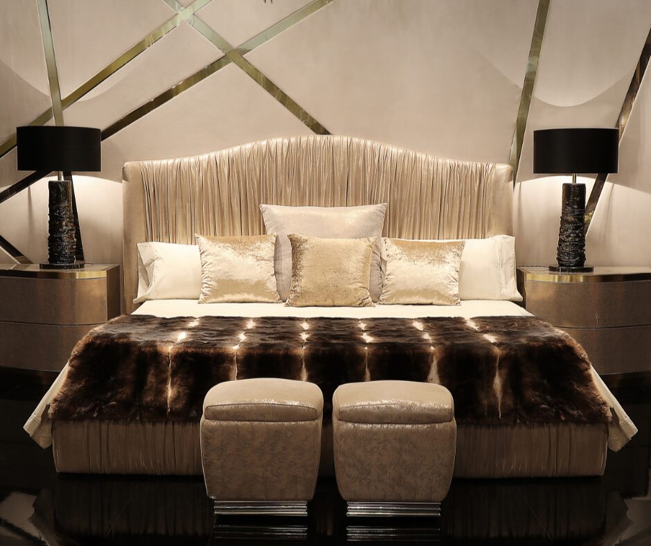 Hand-carved headboard with metallic leaf details.