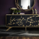 The Story Behind the Design: Spellbound Spellbound Cabinet by KOKET - Midnight Lacquer with Aged Brass Floral Lace